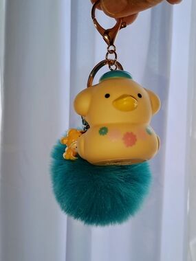 Pompompurin As A Cute Yellow Duck Keychain with Teal Fur Pom Pom